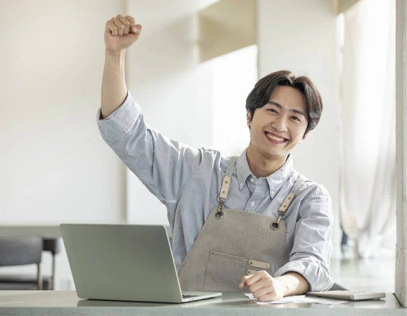 Photo of a store owner checking customer service inquiries
